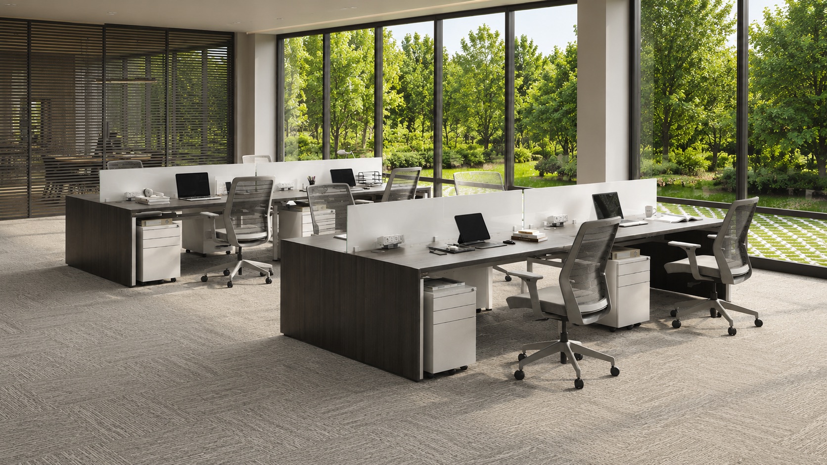 Open-plan office with clean workstations and floor-to-ceiling windows